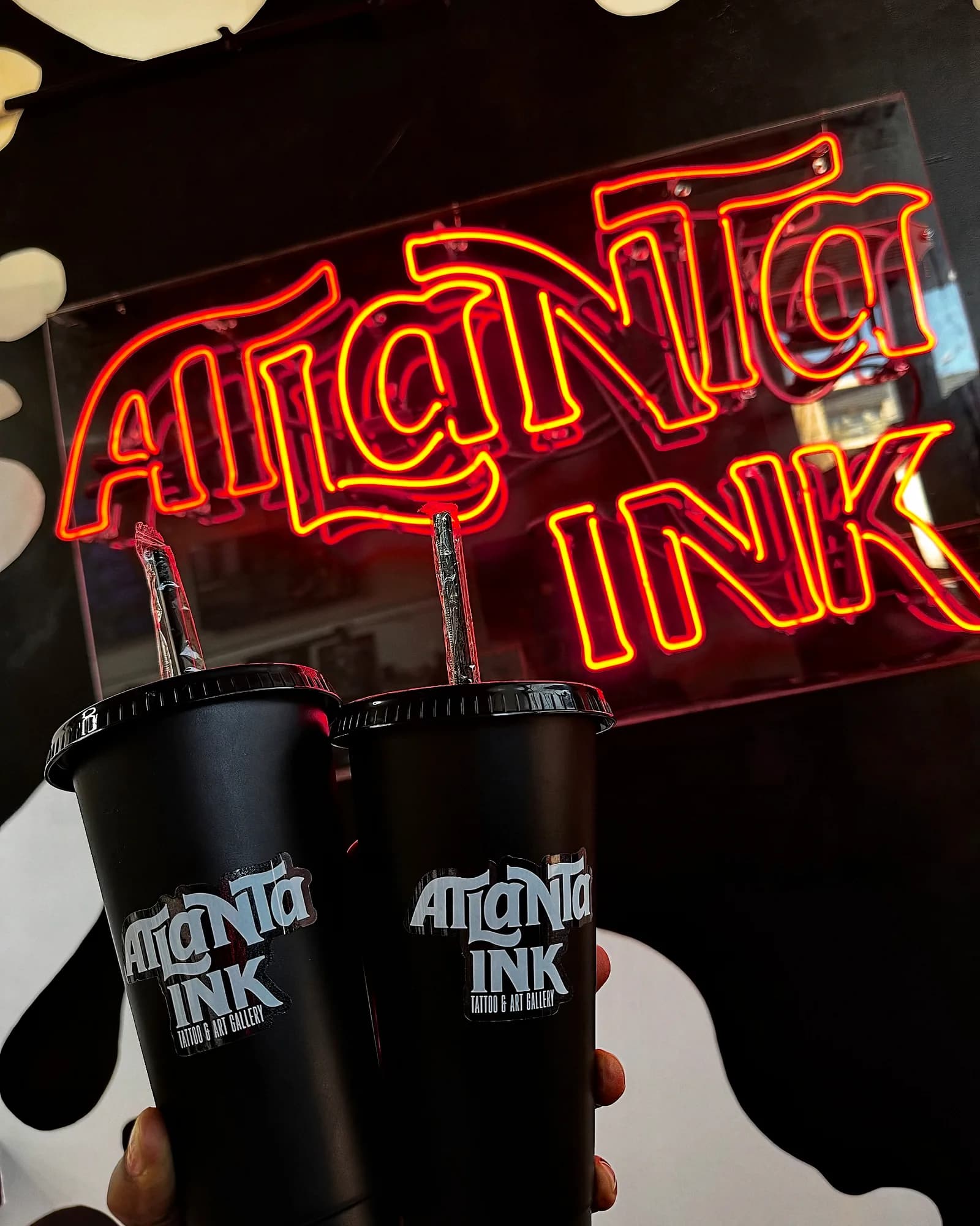 The ATLANTA INK® neon sign lit inside the studio